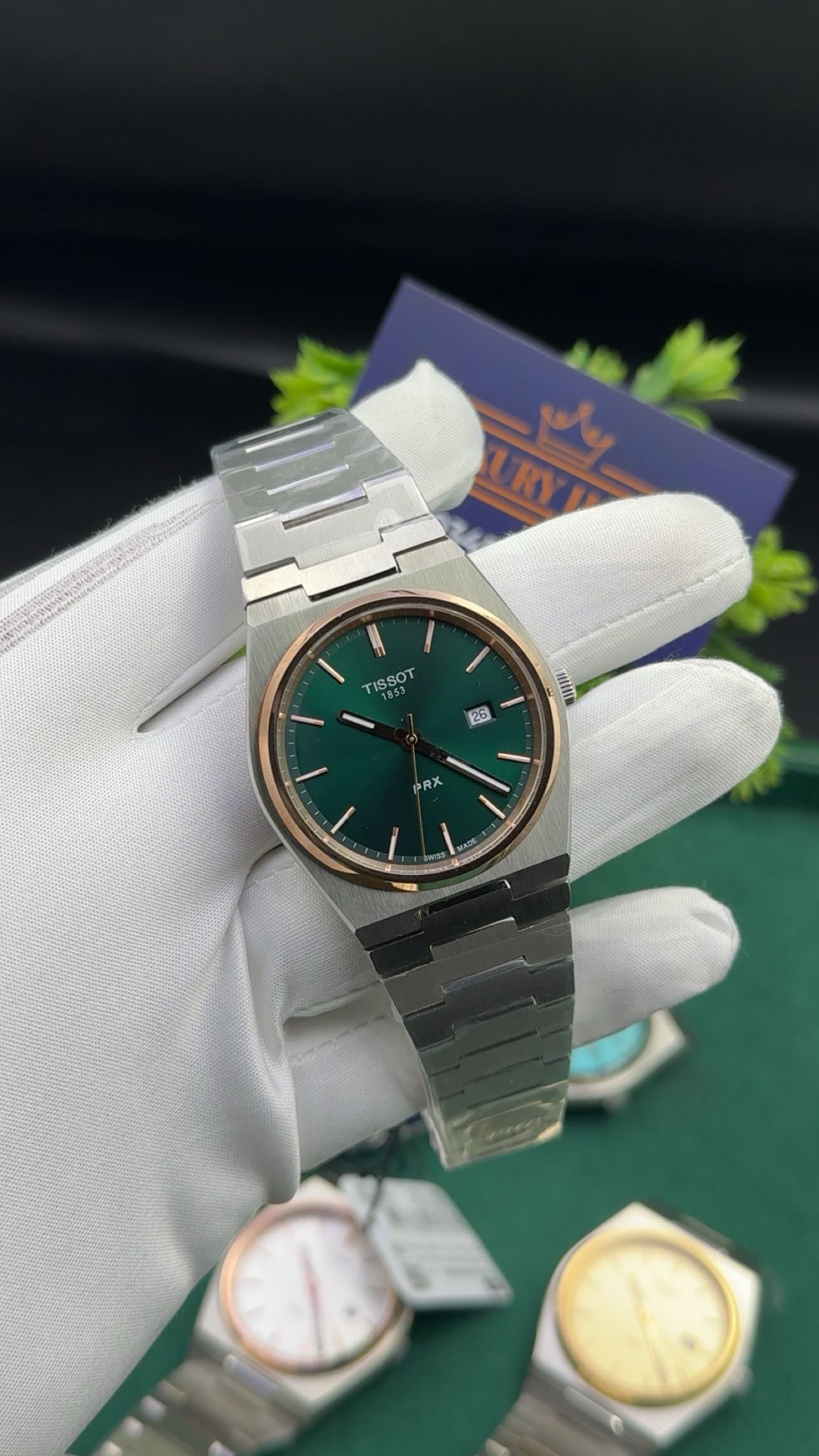 Silver with green dial & rose gold bezel.