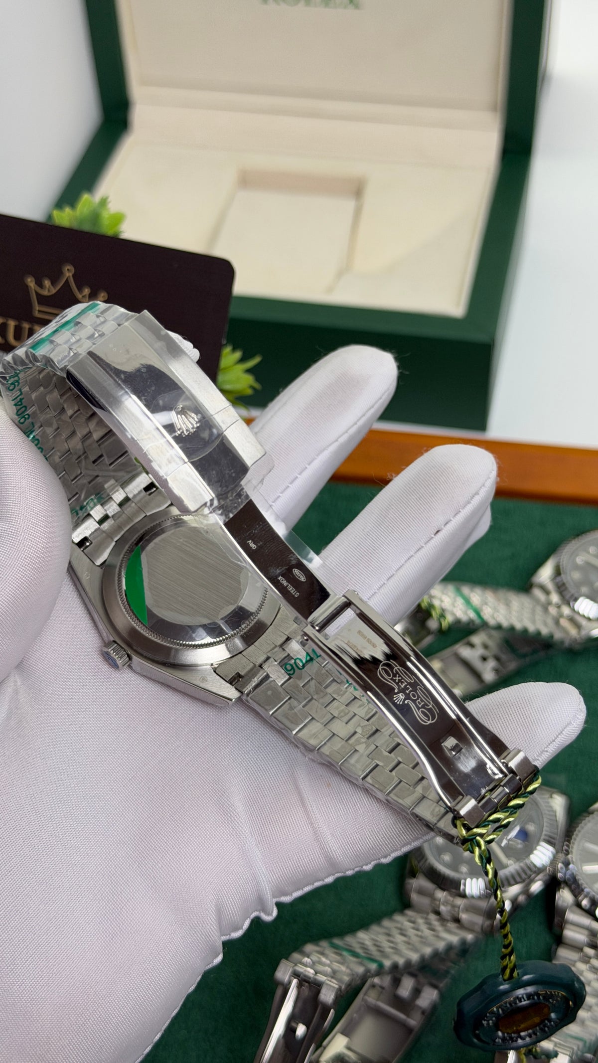Silver with Green Dial.