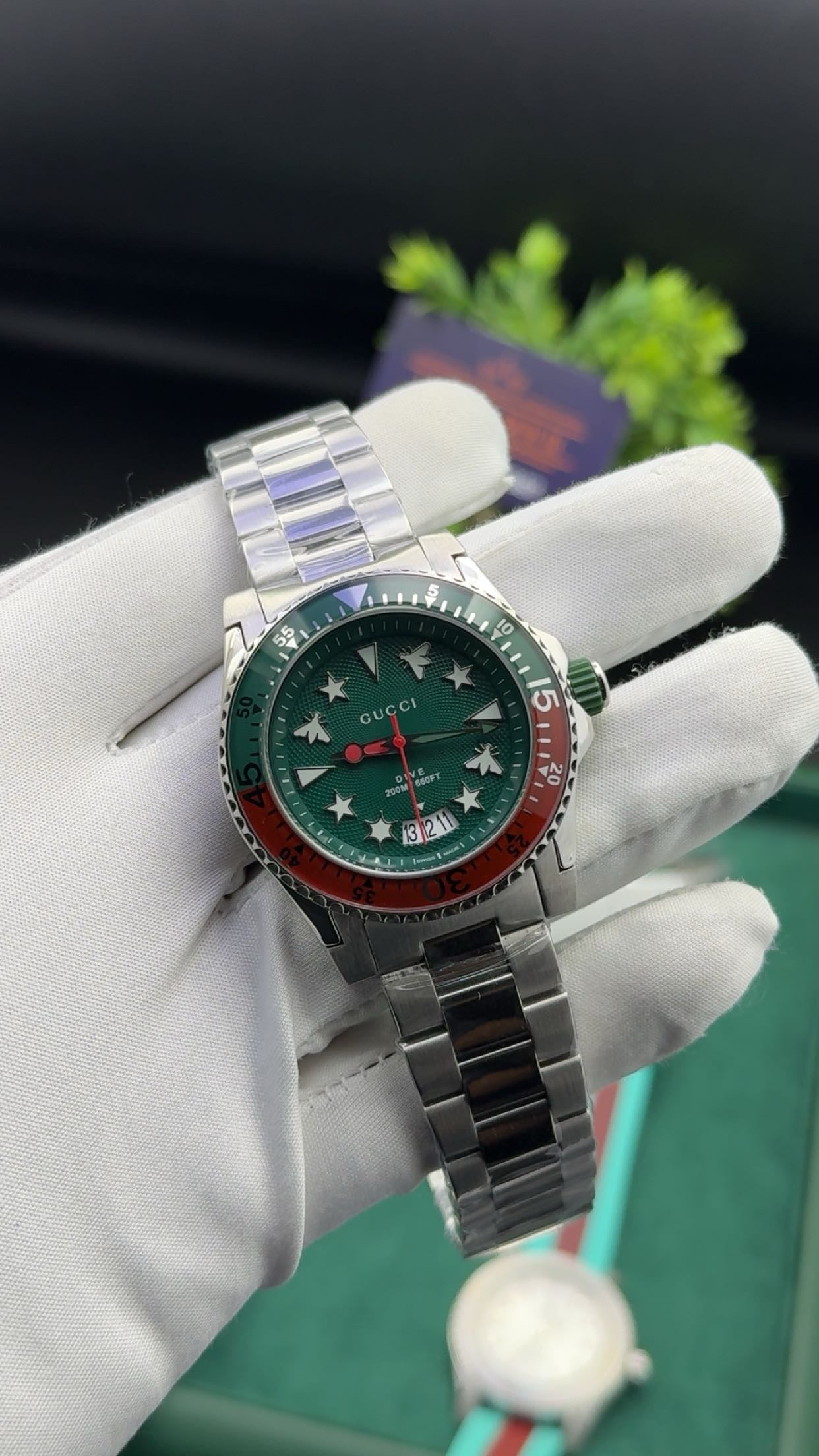 Silver with green dial