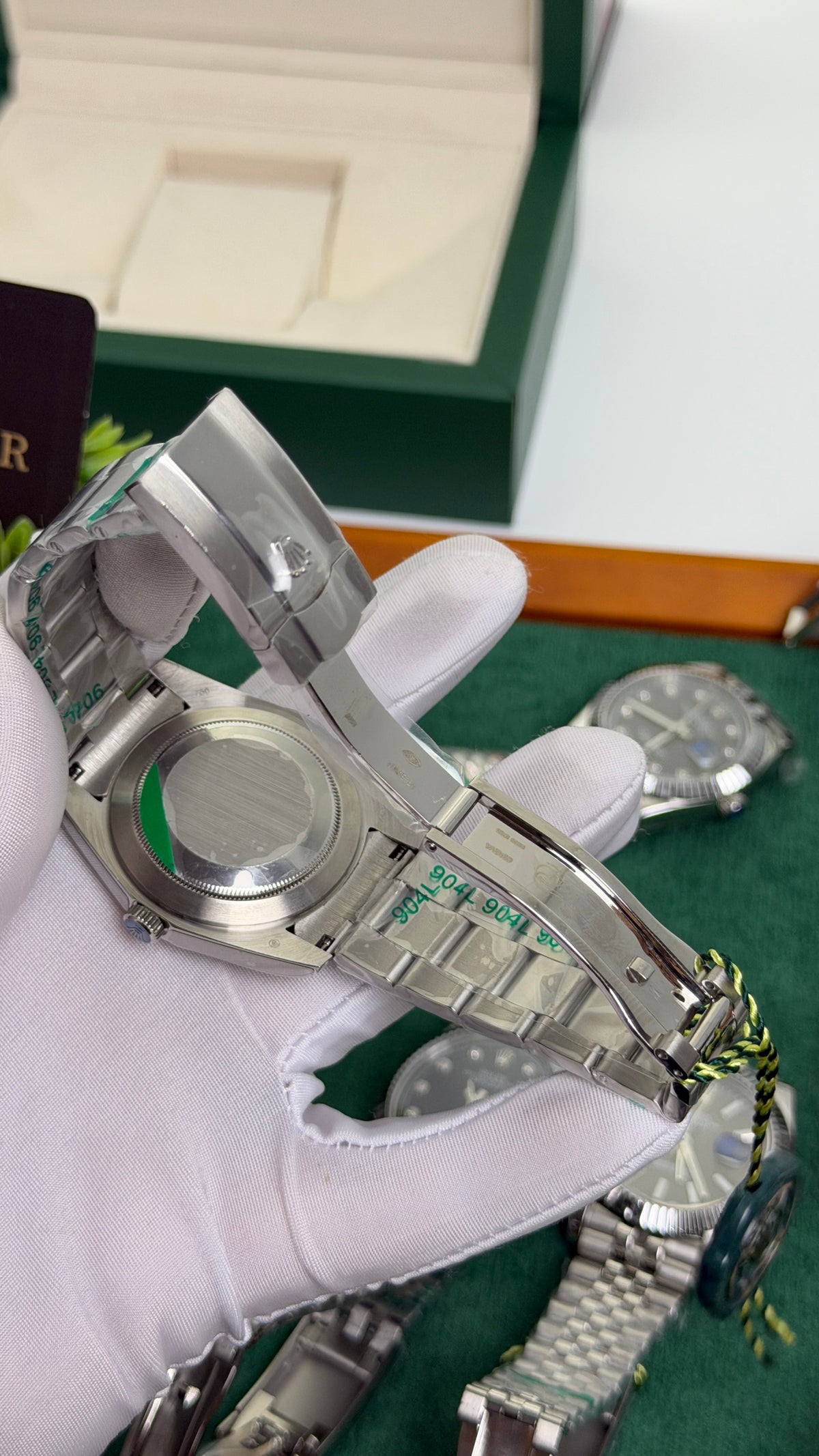 Silver with Green Dial.