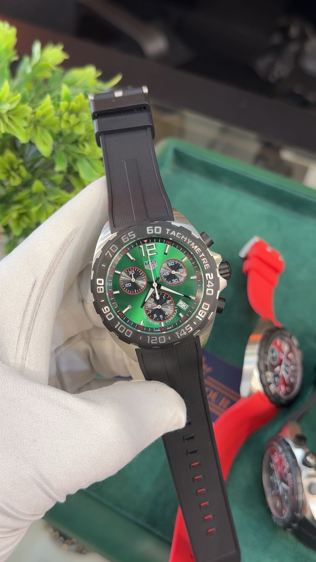Silver with green dial
