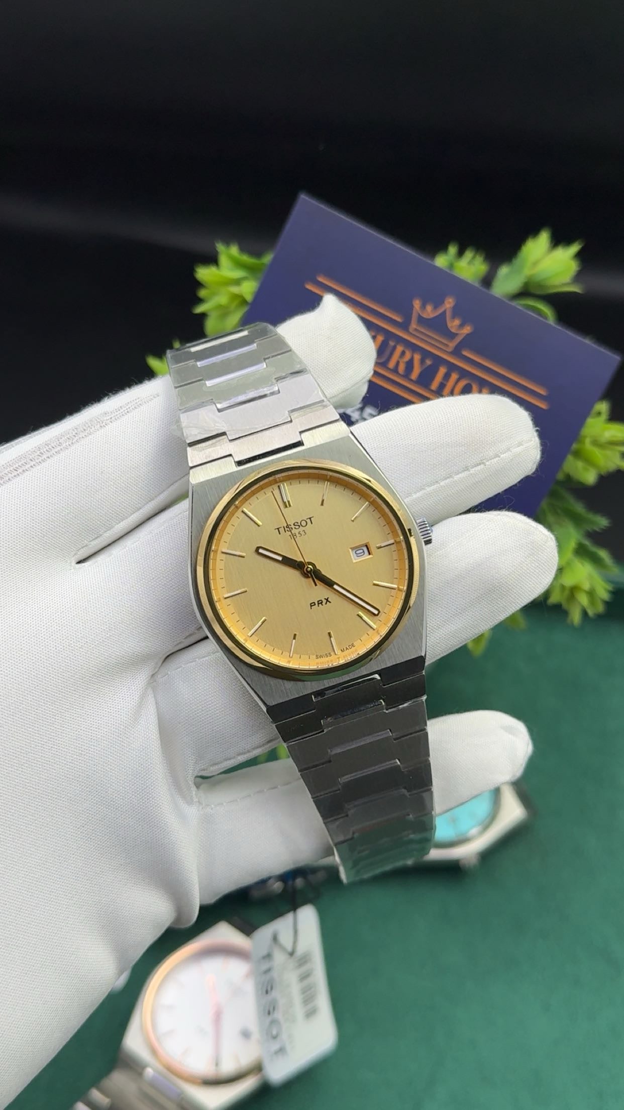 Silver with gold dial & gold bezel.