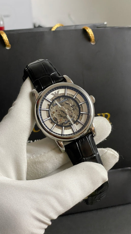 Silver with Skeleton Dial.