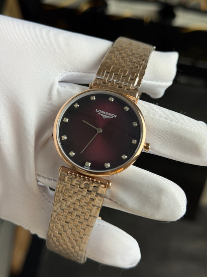 Rose Gold with Maroon Dial.