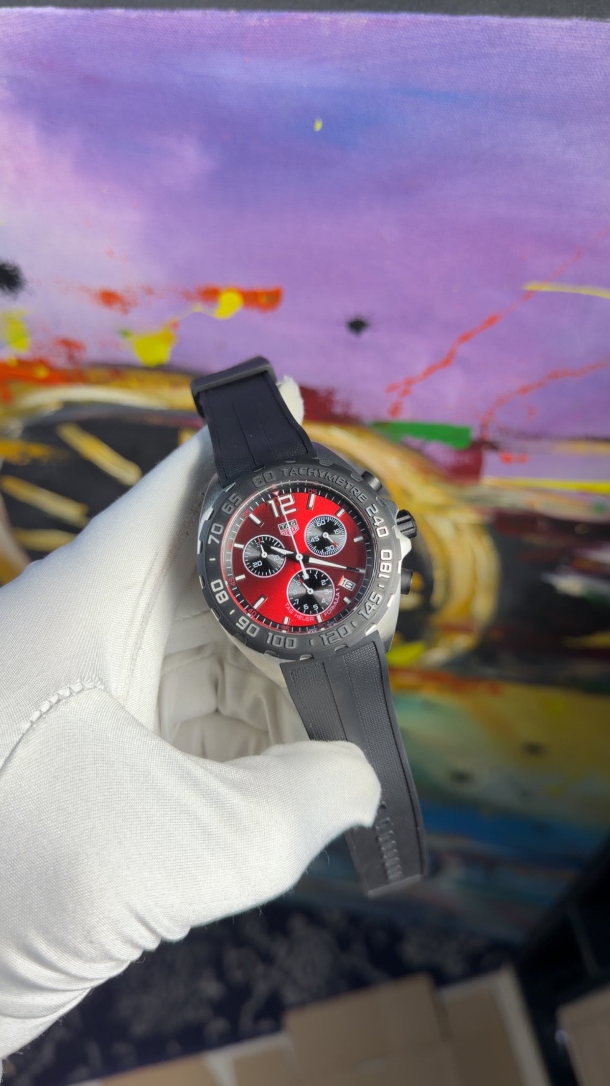 Silver with red dial