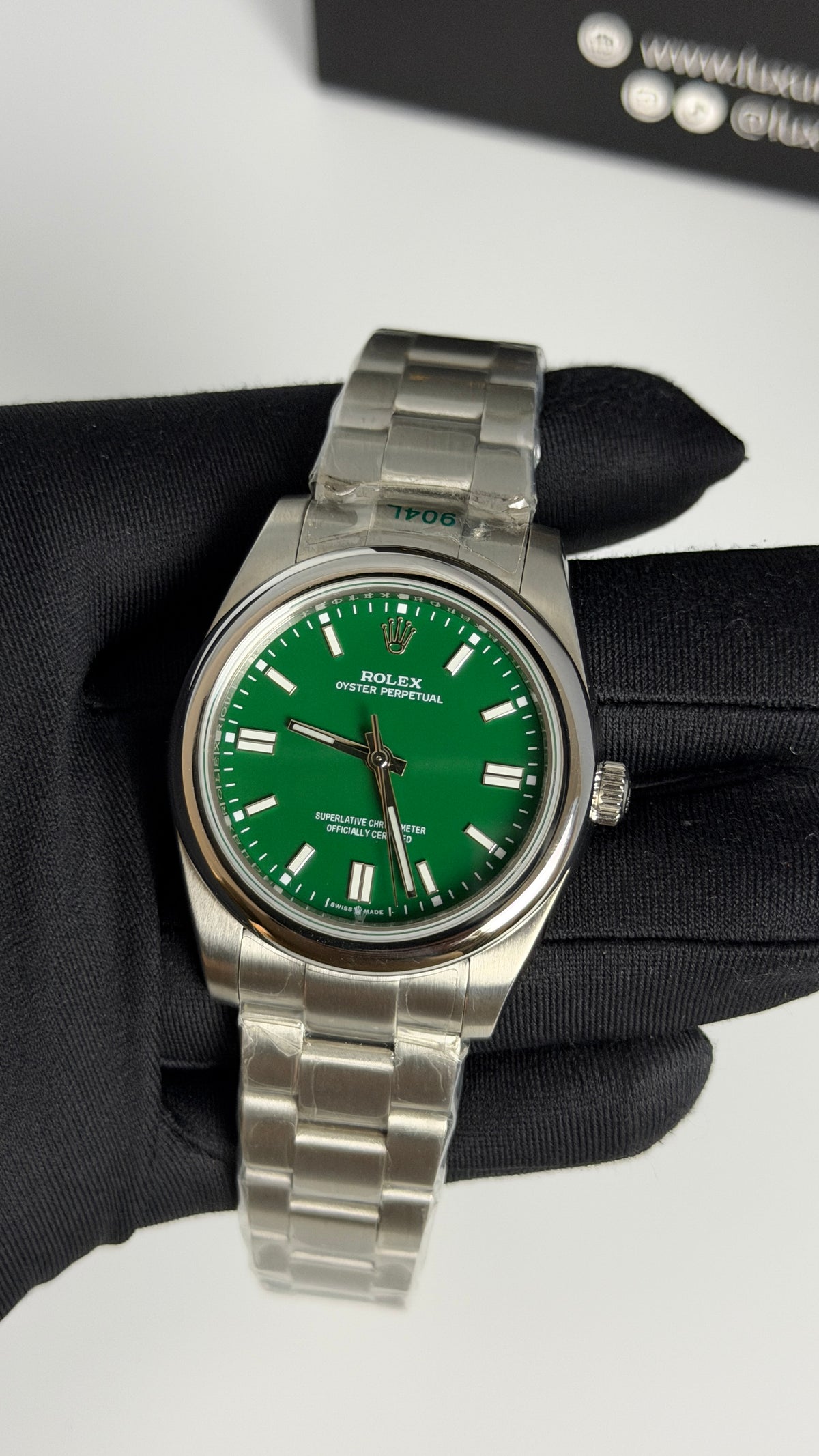 Silver with Green Dial.