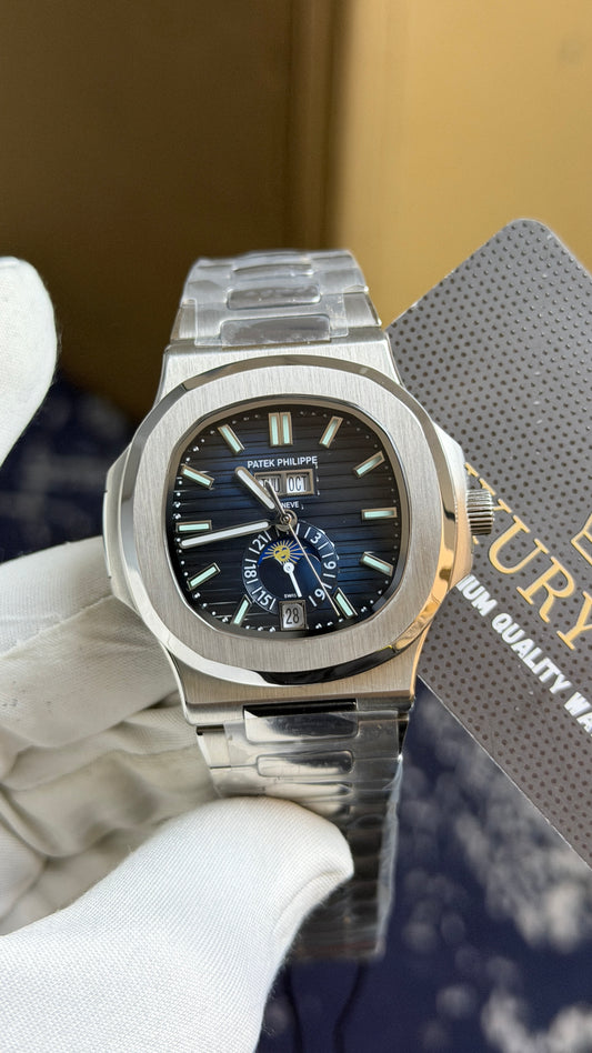 Silver with Aqua Dial.