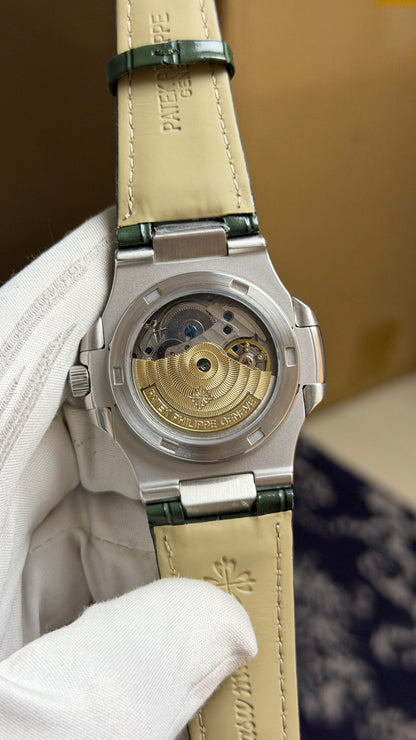Silver with Green Dial.