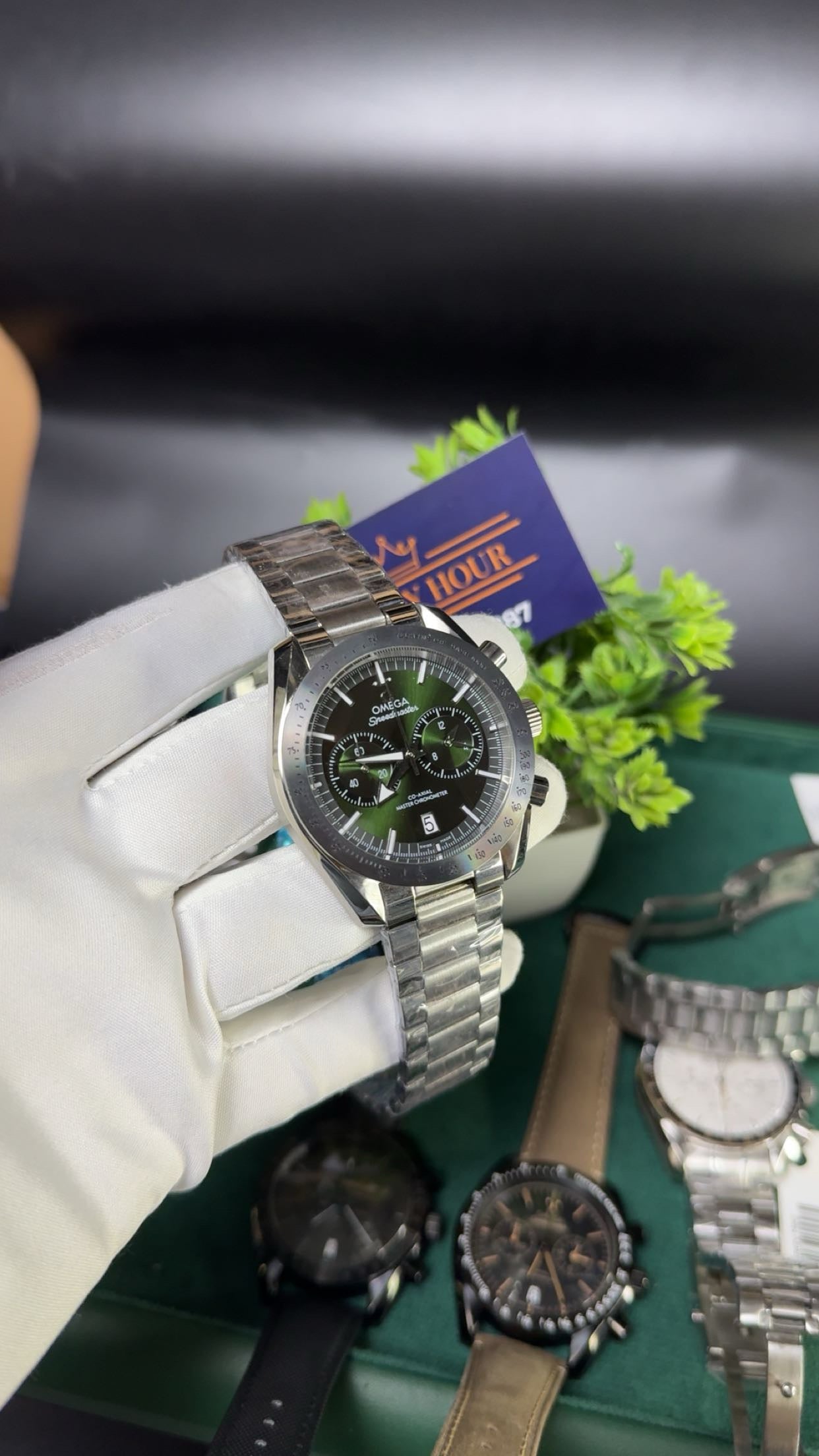 Silver with green dial