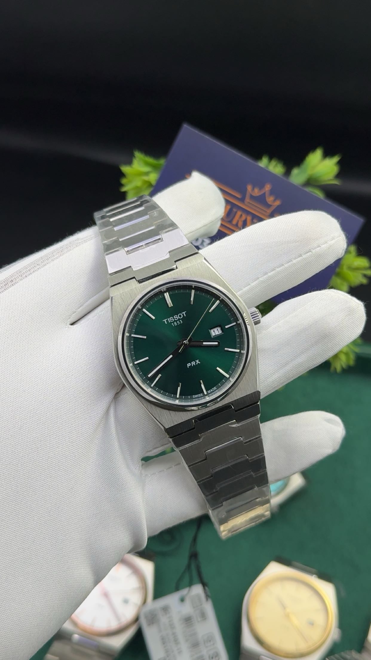 Silver with green dial