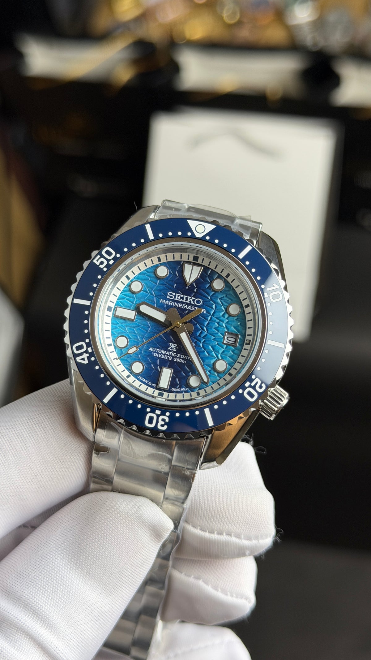Silver with Blue Dial.