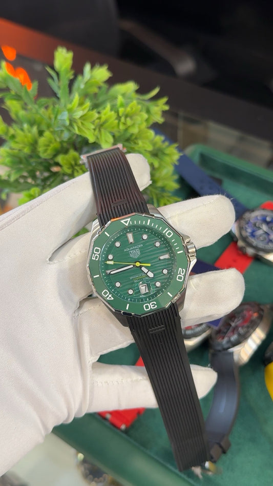 Silver with green dial