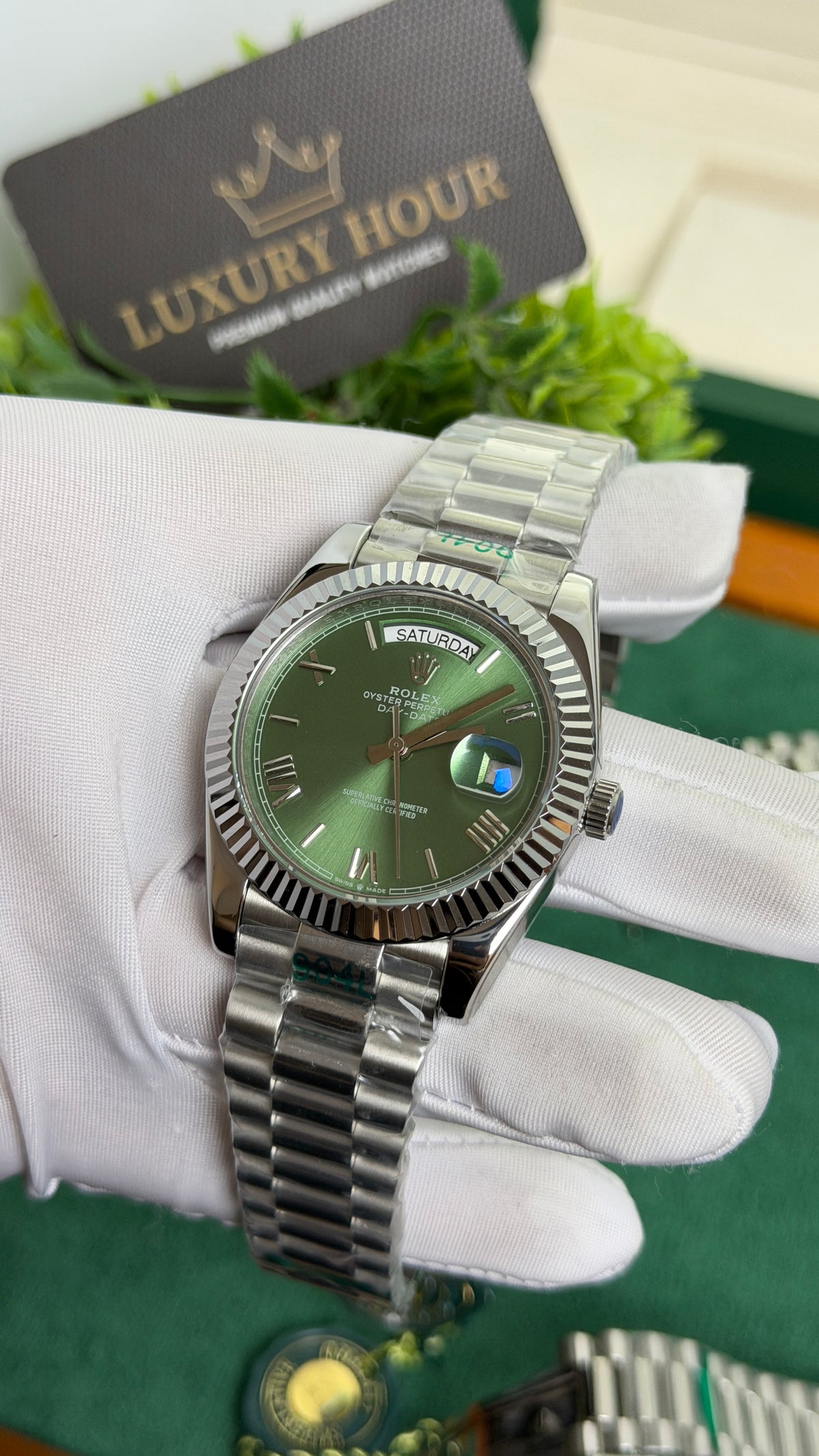 Silver with Green Dial.