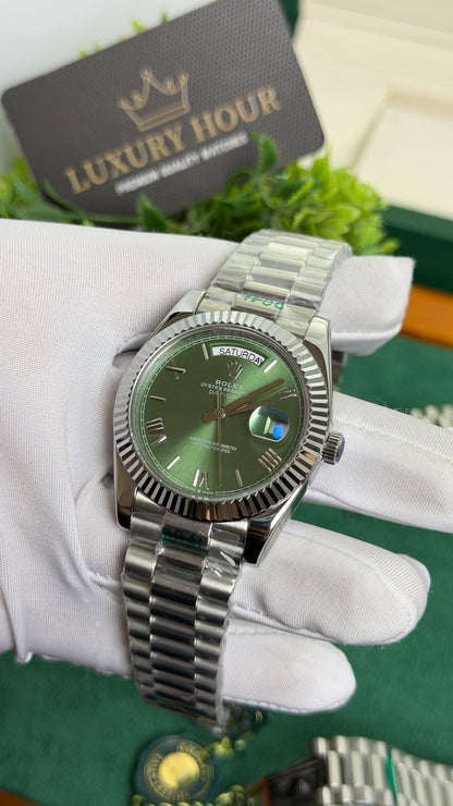 Silver with Green Dial.