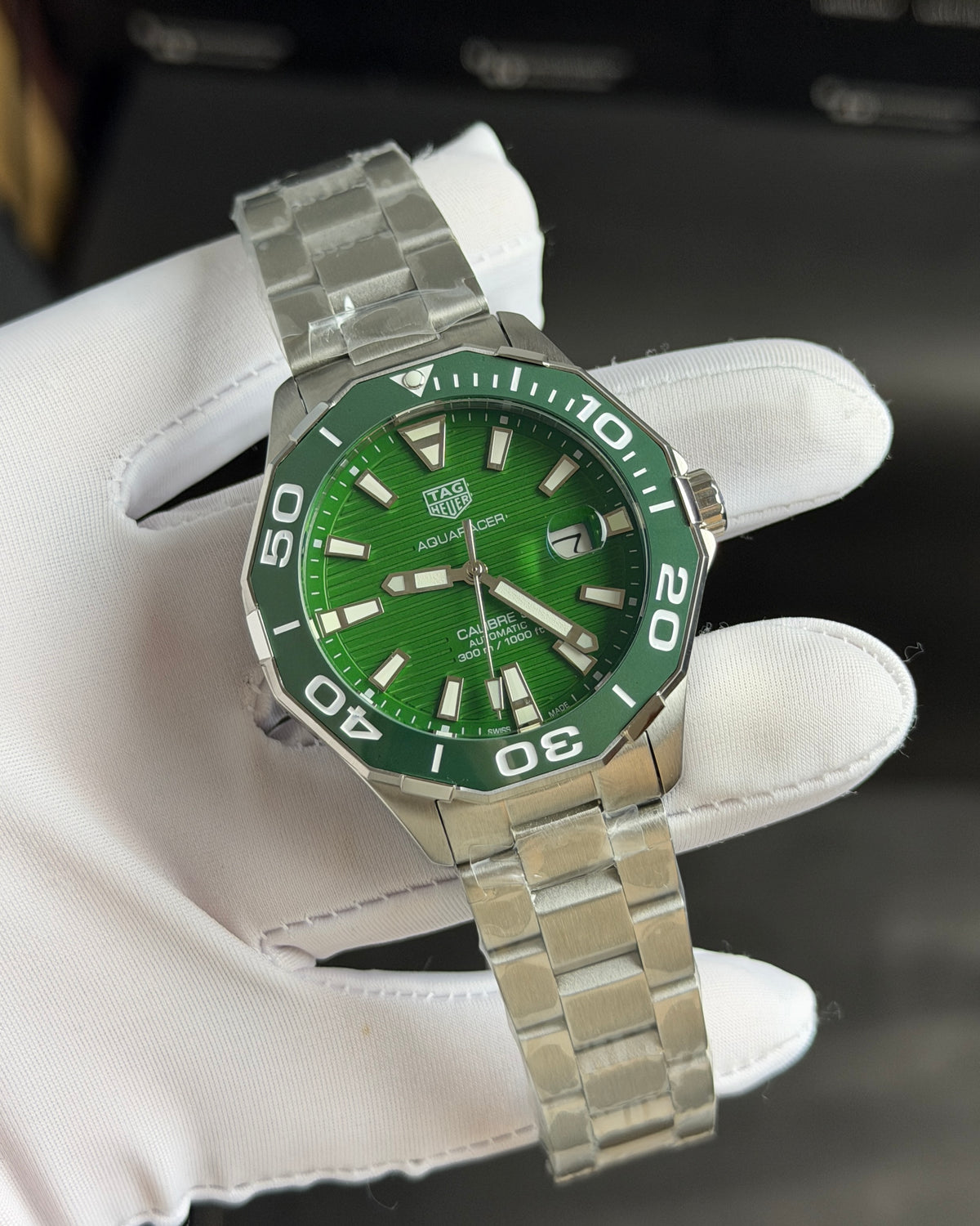Silver with Green Dial.