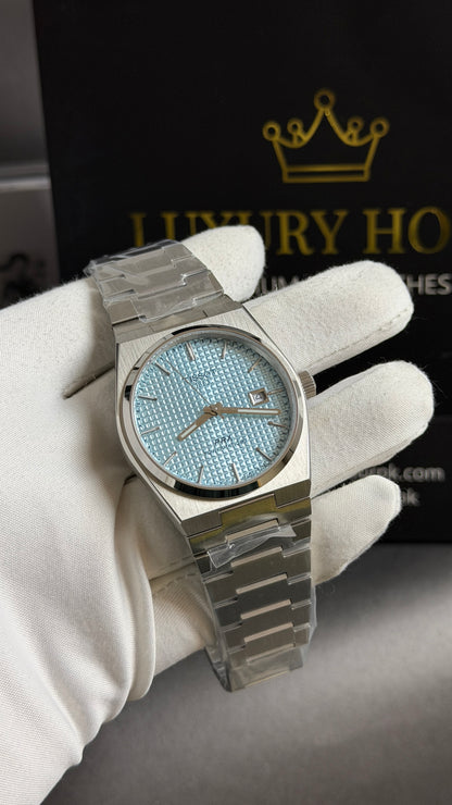 Silver with Blue Dial.