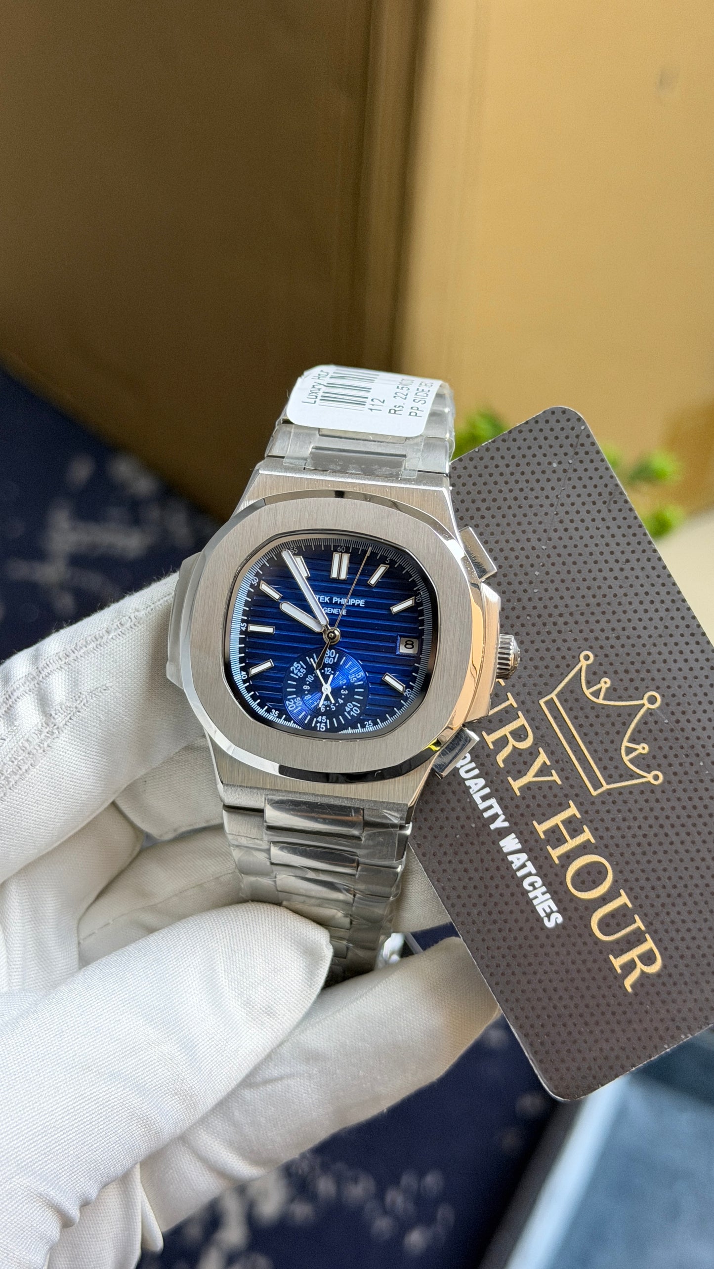 Silver with blue Dial.