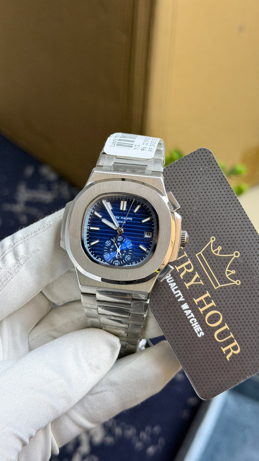 Silver with blue Dial.