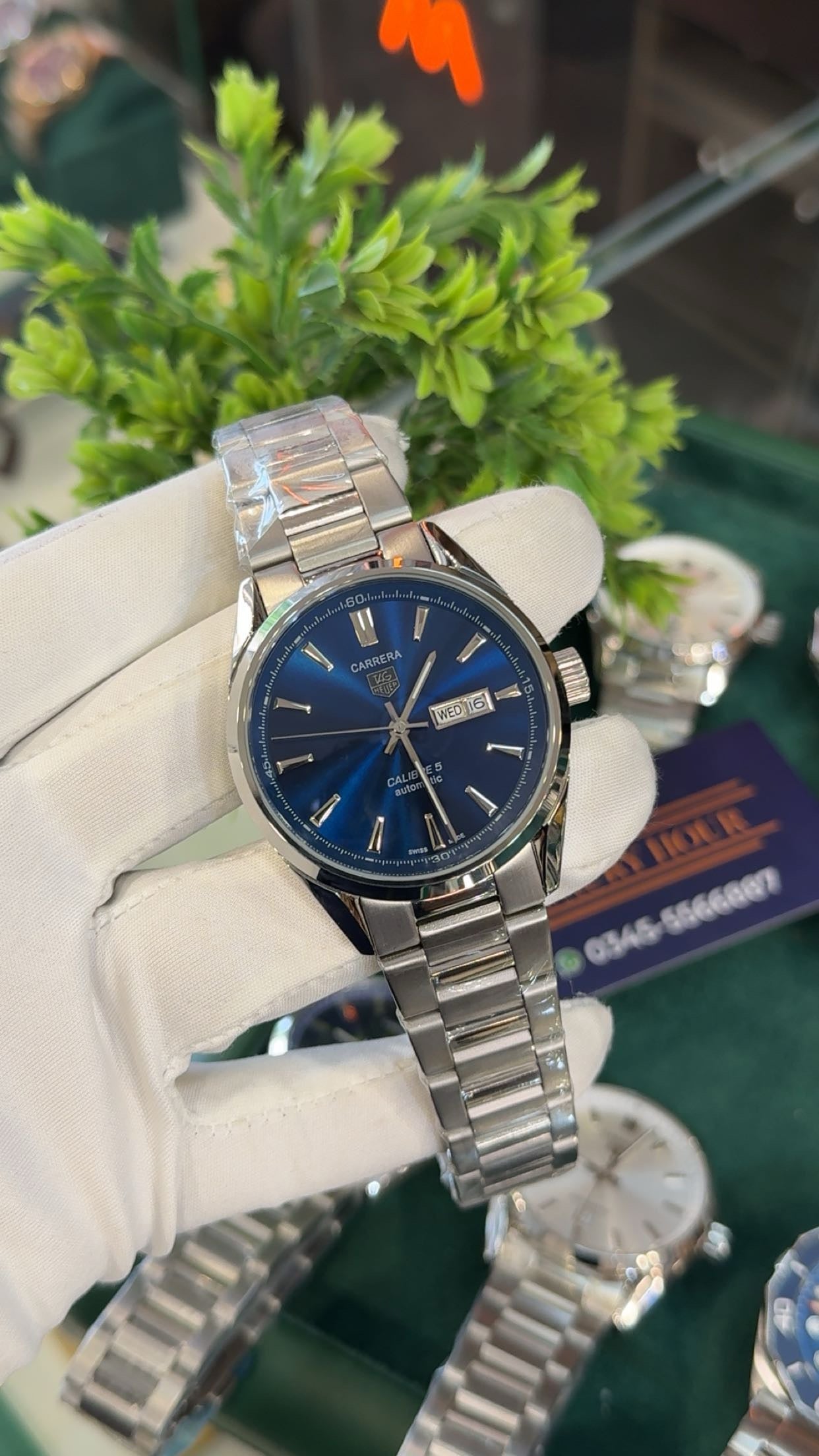 Silver with blue dial