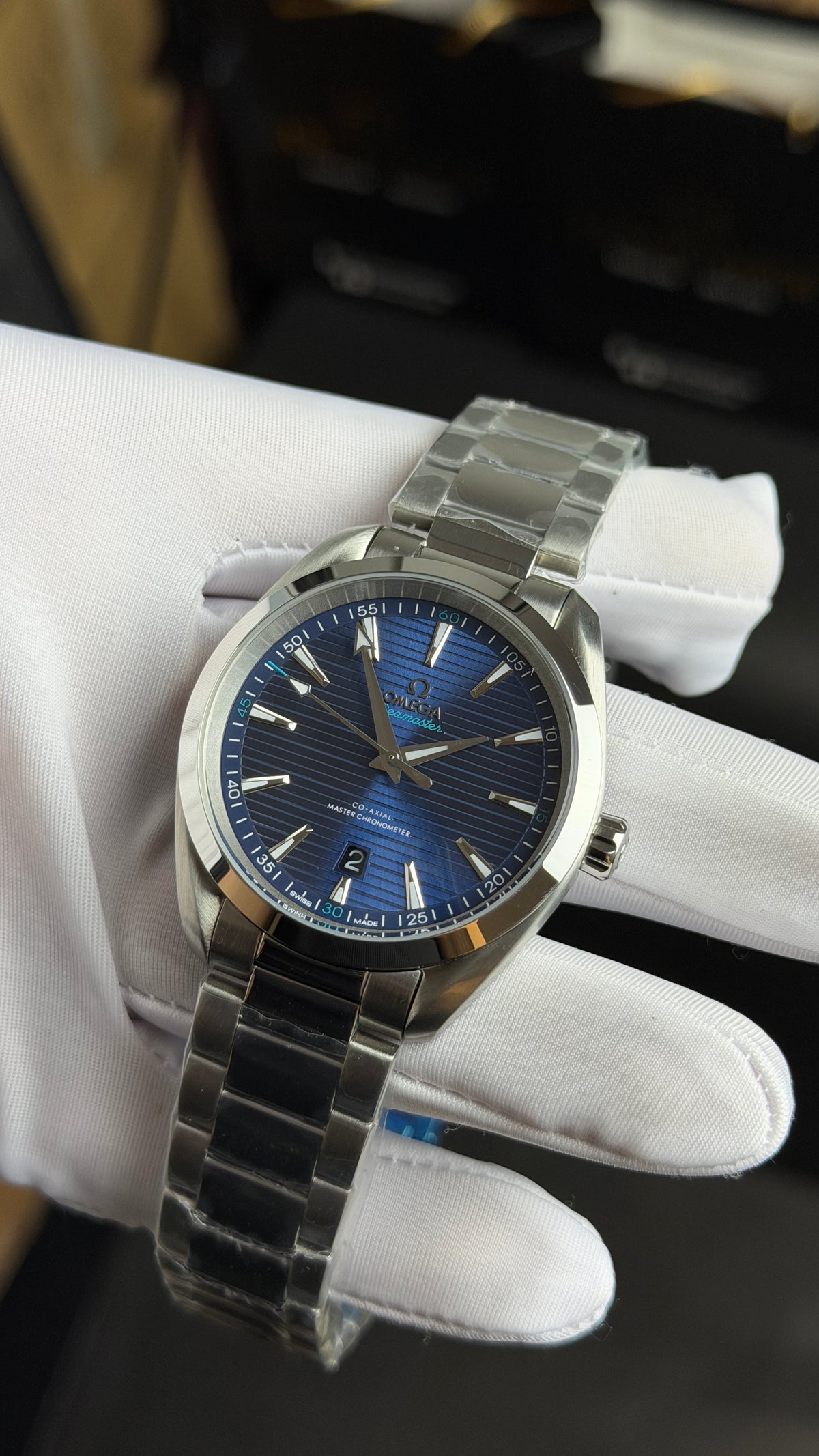 Silver with Aqua Dial.