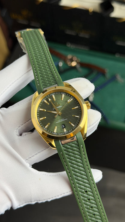 Yellow Gold with Green Dial.