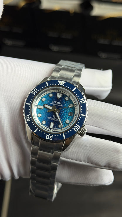 Silver with Blue Dial.