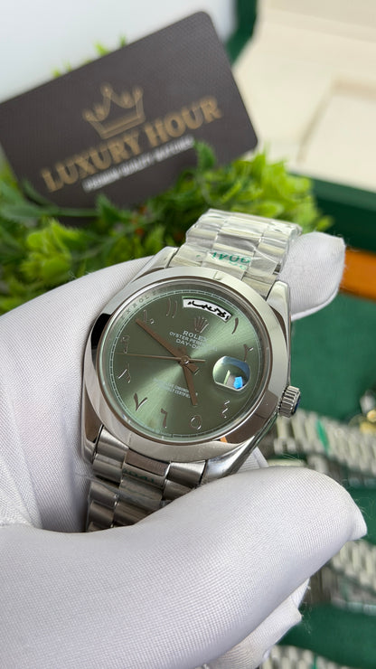 Silver with Green Dial.