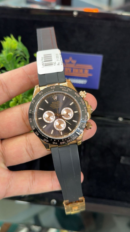 Rose gold with black dial.