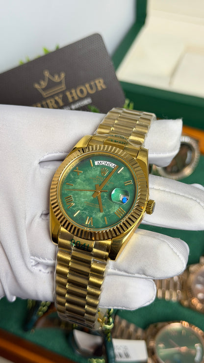 Yellow Gold with Green Marble Dial.