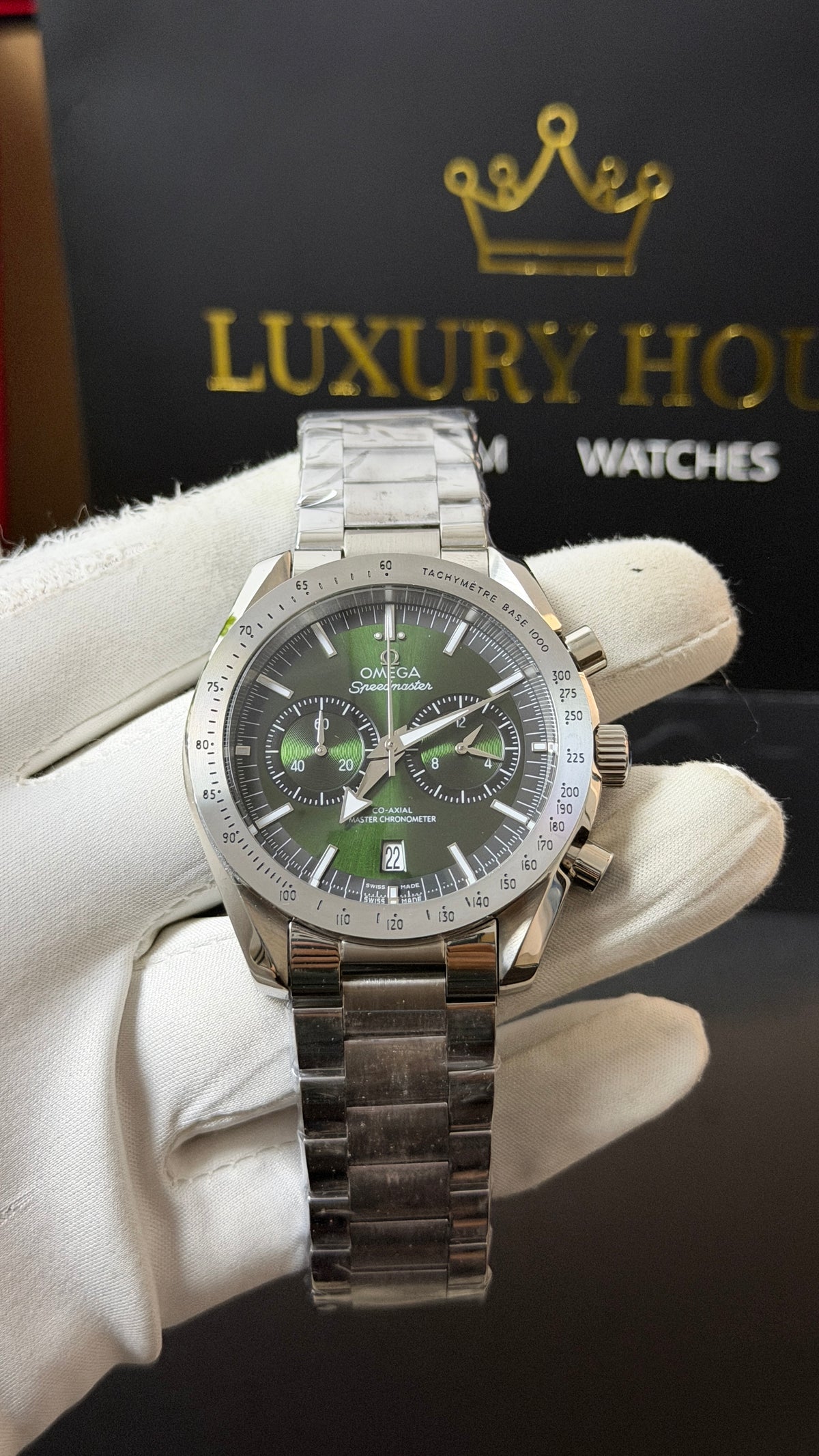 Silver with Green Dial.