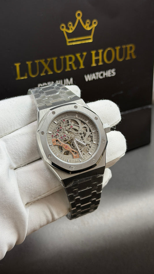 Silver with White Skeleton Dial.
