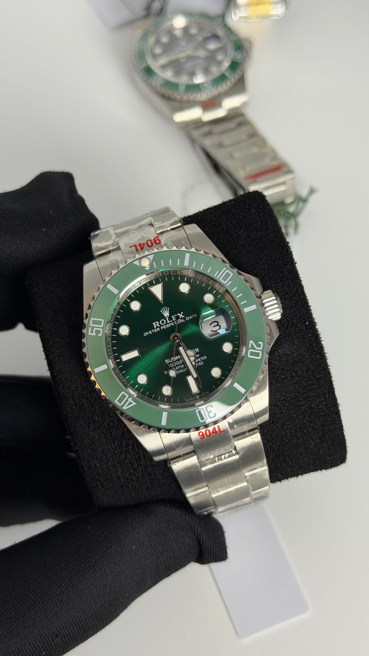 Silver With Green Dial.
