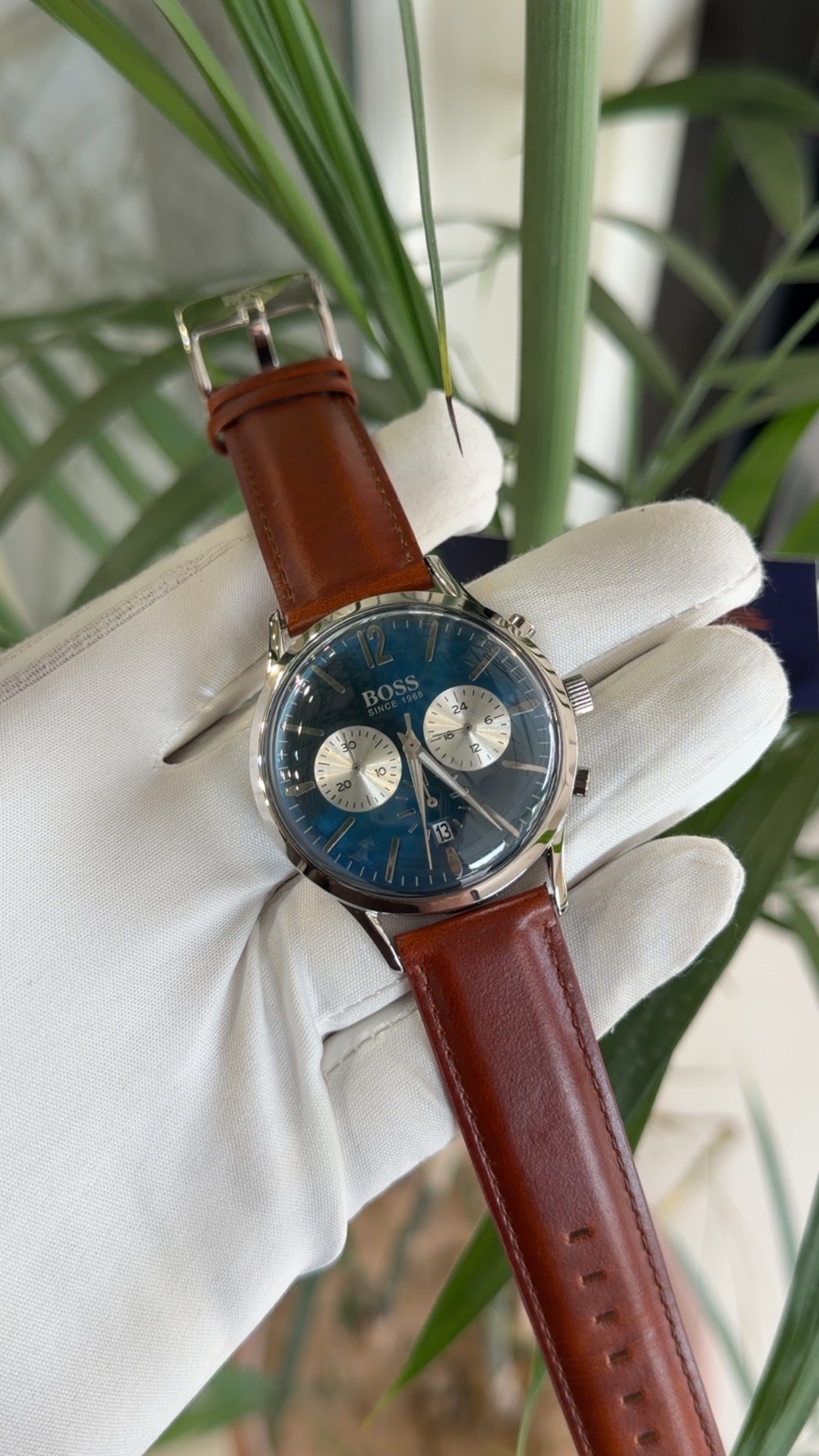 Silver with blue dial and brown strap