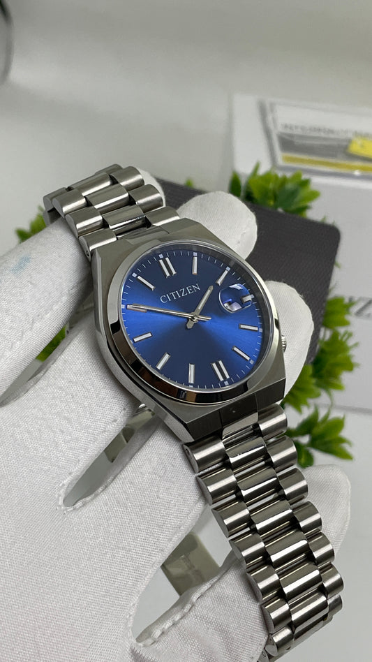 Silver with Aqua Dial.