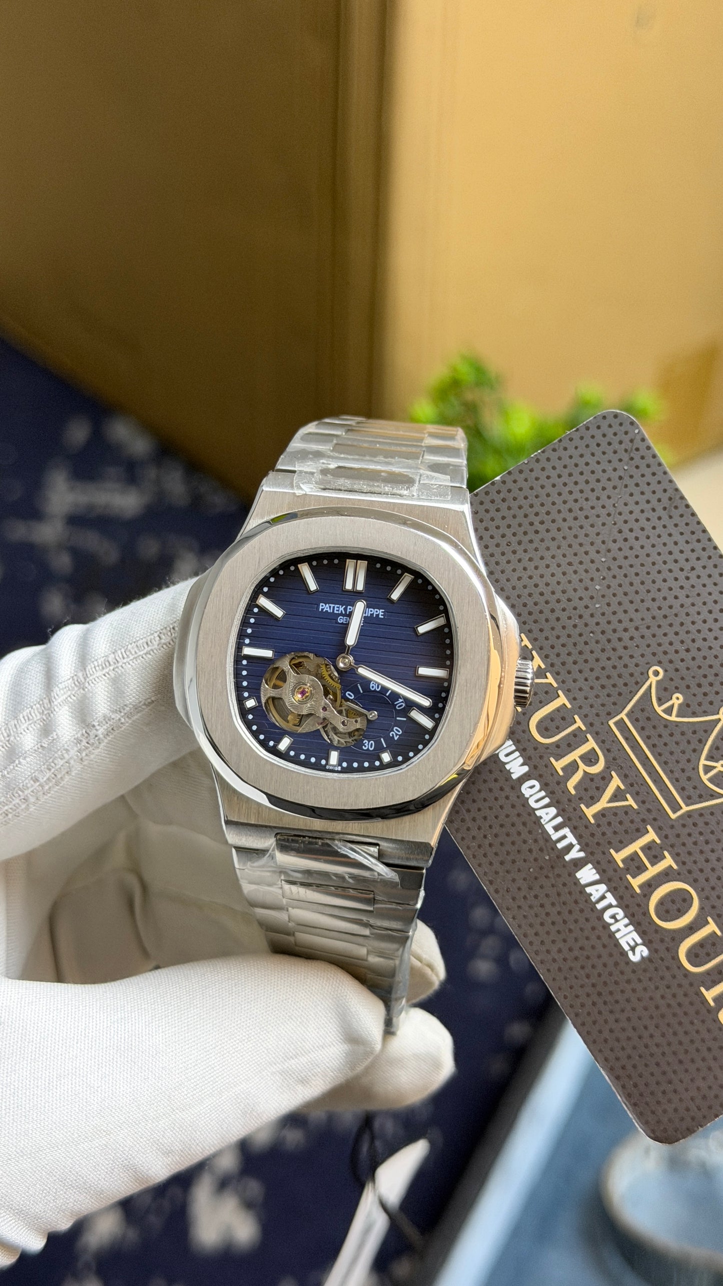 Silver with Aqua Dial.