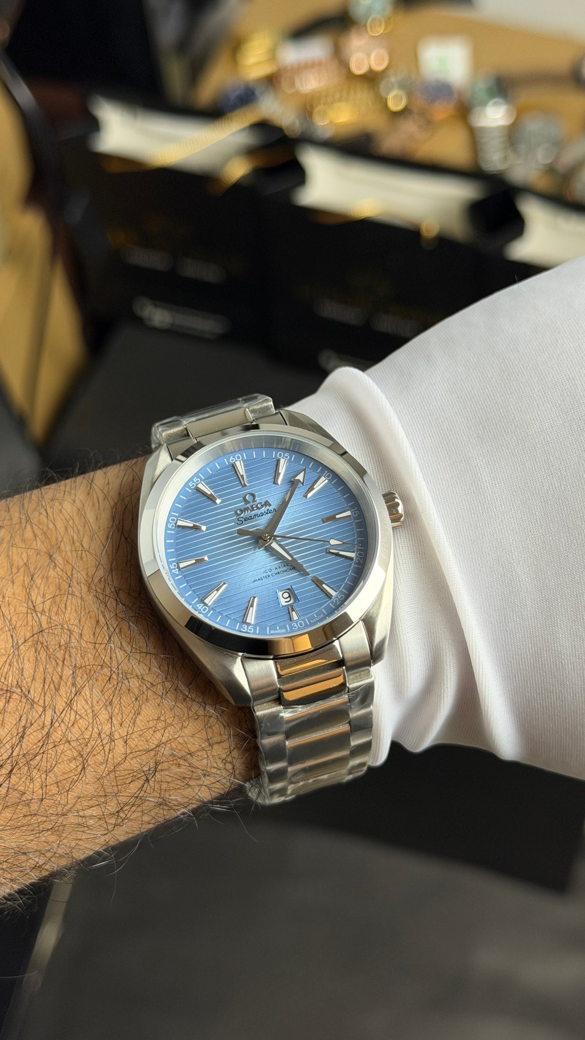 Silver with Sky Blue Dial.