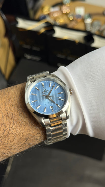 Silver with Sky Blue Dial.