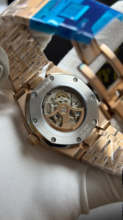 Rose Gold Two Tone with Blue Skeleton Dial.