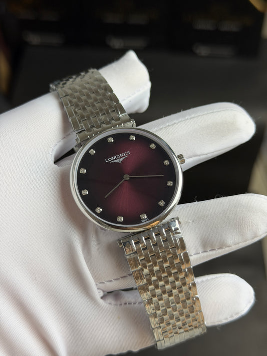 Silver with Maroon Dial.