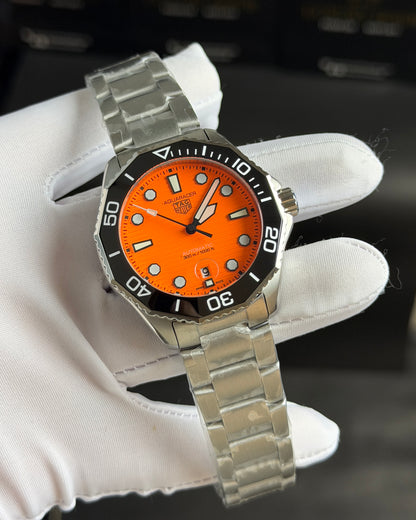 Silver with Orange Dial.