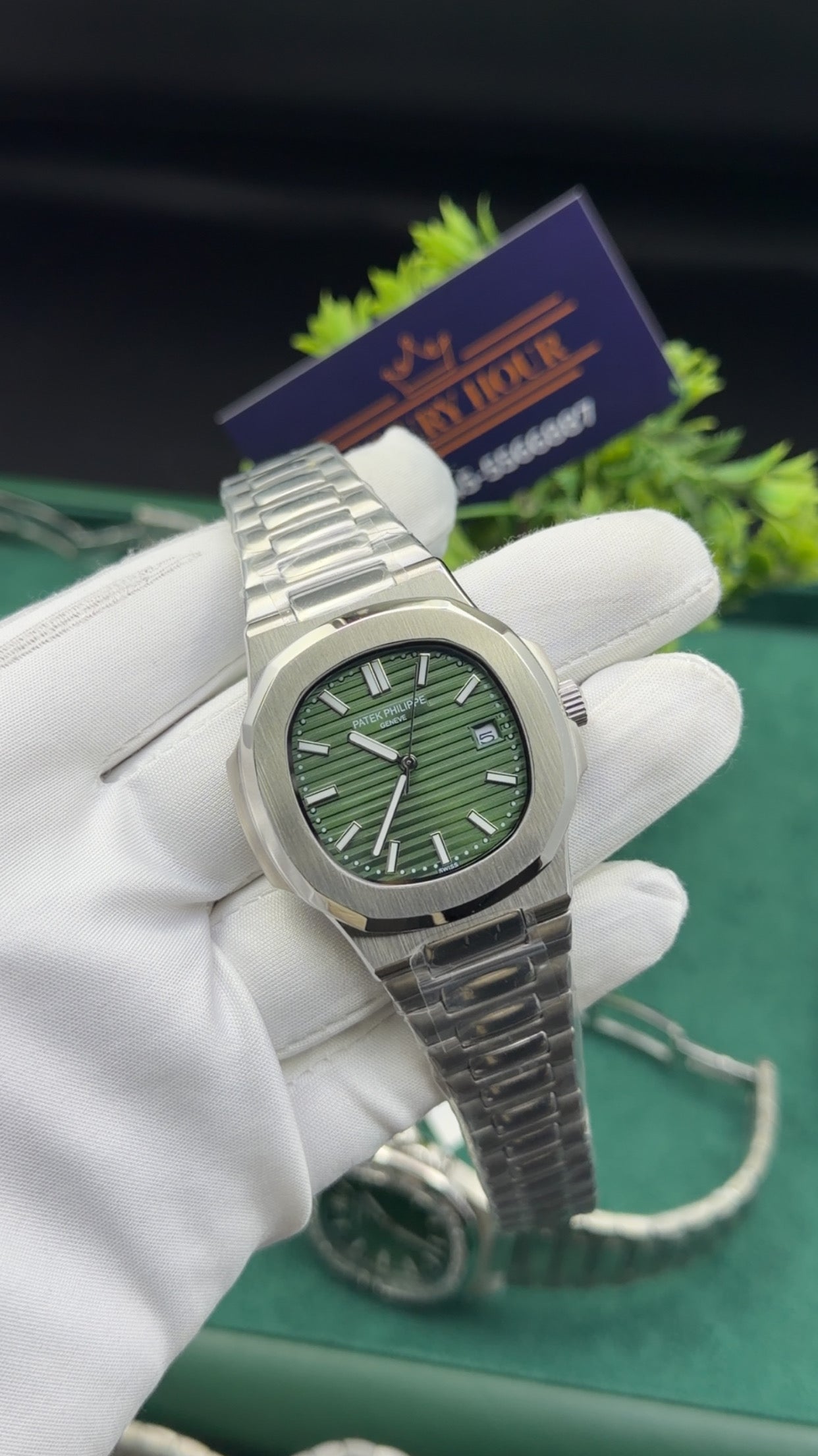 Silver with green dial