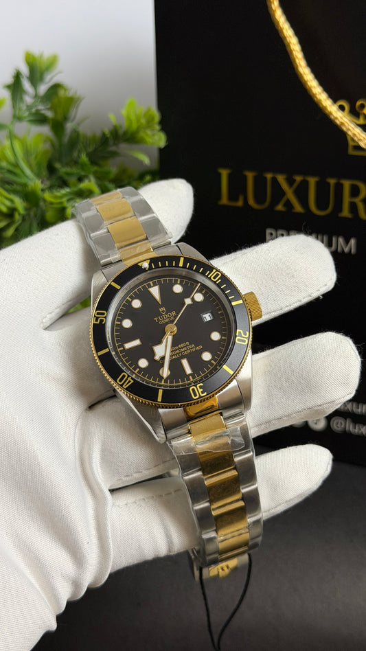 Yellow Gold Two Tone with Black Dial.