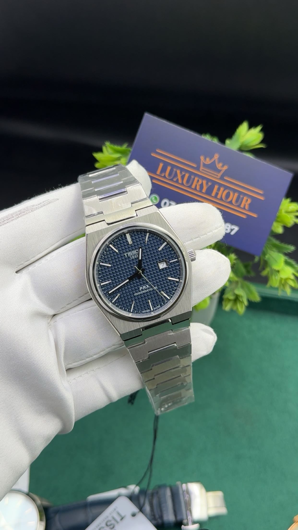 Silver with blue dial.