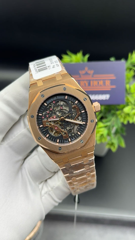 Rose gold with black dial.