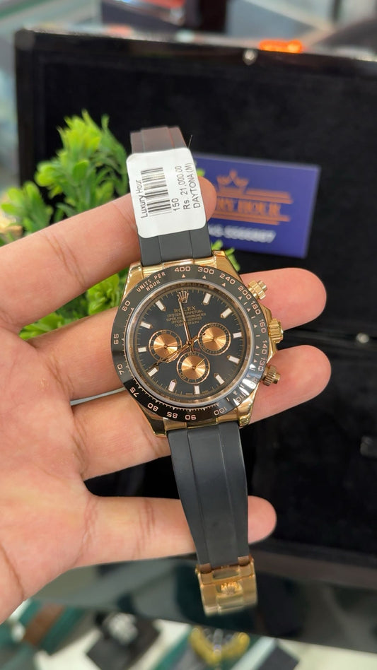 Rose gold with black dial.