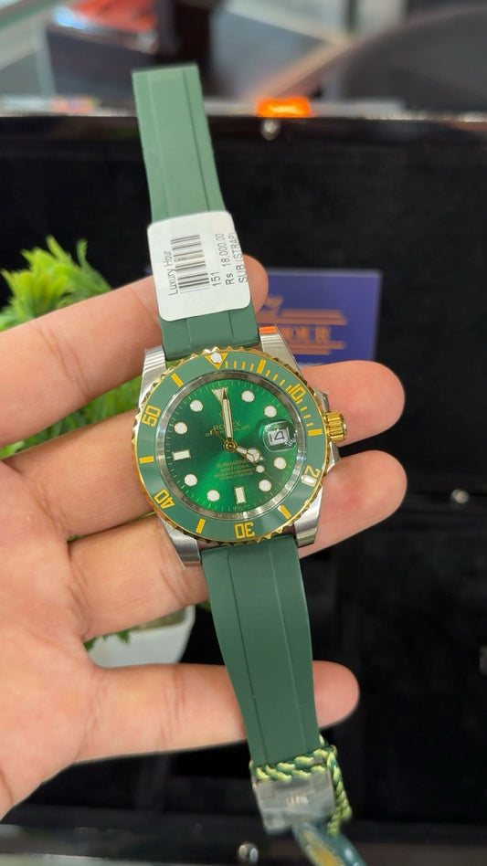 Gold two tone with green dial