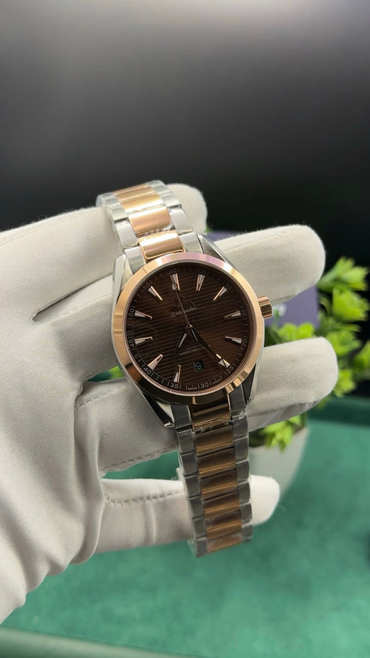 Rose gold two tone with chocolate dial