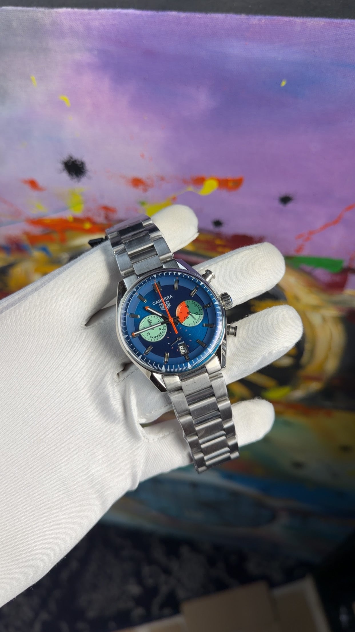 Silver with blue dial