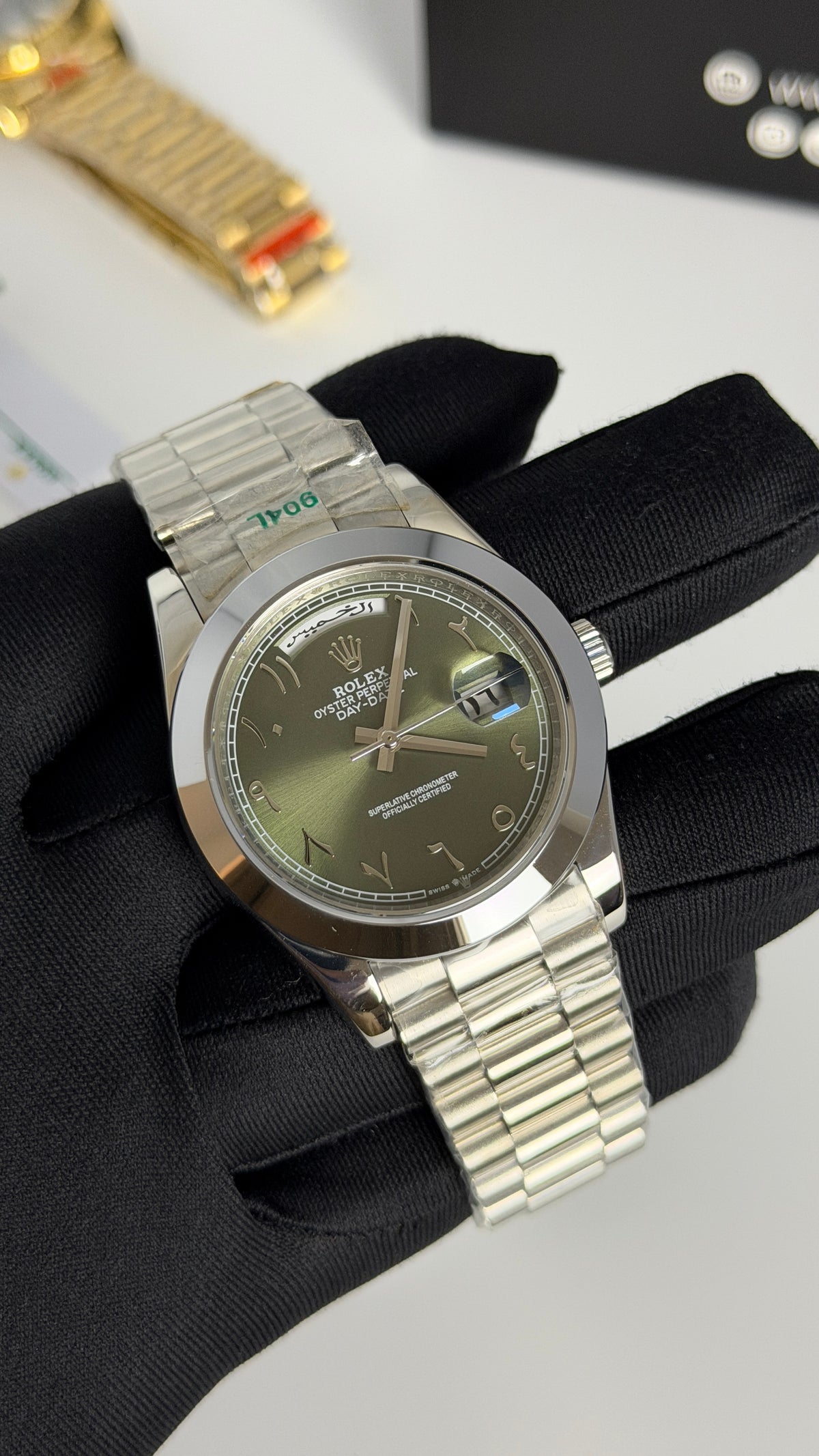 Silver with Green Dial.