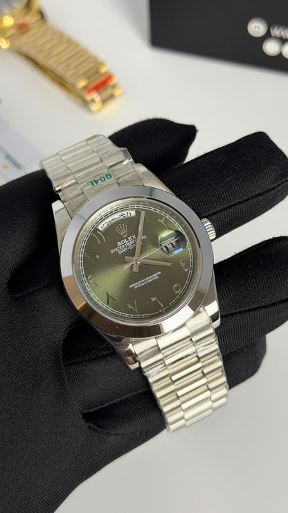 Silver with Green Dial.